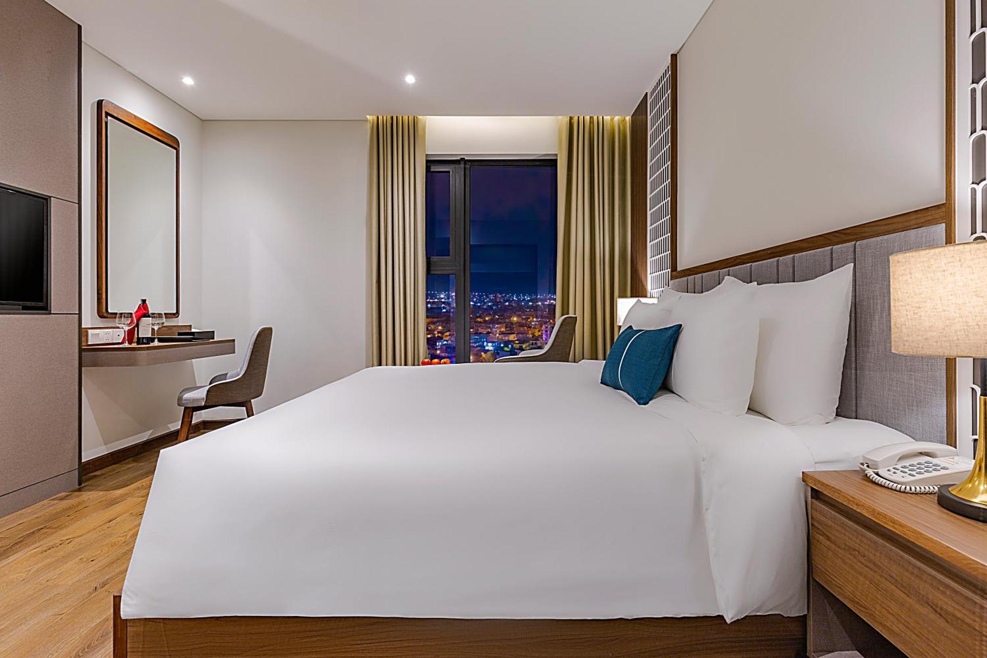 Peninsula Hotel Danang Quarto foto